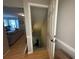 View of the home's staircase to the basement and the adjacent living room with hardwood flooring at 1104 Huntington Se Trce, Smyrna, GA 30082