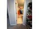 A bathroom with a door slightly open showing a white toilet, shower curtain, and floor at 1104 Huntington Se Trce, Smyrna, GA 30082