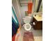 Bright bathroom featuring a white toilet with a bidet, a decorative rug, and a towel rack at 1104 Huntington Se Trce, Smyrna, GA 30082
