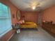 Well-lit bedroom with neutral walls, a ceiling fan, and a comfortable bed at 1104 Huntington Se Trce, Smyrna, GA 30082