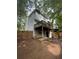Exterior of home with balcony overlooking fenced backyard and mature trees at 1104 Huntington Se Trce, Smyrna, GA 30082