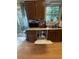 A kitchen with brown wood cabinets, light countertops, and a stainless steel sink at 1104 Huntington Se Trce, Smyrna, GA 30082