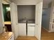 Convenient laundry closet with modern washer and dryer units near a half bathroom at 1104 Huntington Se Trce, Smyrna, GA 30082