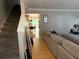 Inviting living room features hardwood floors, a comfortable sofa, and a staircase leading to the upper level at 1104 Huntington Se Trce, Smyrna, GA 30082