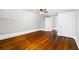 Bedroom featuring white walls and hardwood floors with two doors at 159 S Forest S Ave, Social Circle, GA 30025