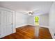 Bedroom featuring hardwood floors, ceiling fan, white walls, and natural light at 159 S Forest S Ave, Social Circle, GA 30025