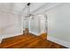 Dining room with hardwood floors and modern lighting fixture at 159 S Forest S Ave, Social Circle, GA 30025