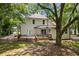 Two-story house with back deck and backyard with mature trees at 159 S Forest S Ave, Social Circle, GA 30025