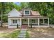 Beautiful two-story home with a welcoming covered porch and well-maintained landscaping at 159 S Forest S Ave, Social Circle, GA 30025