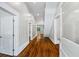 Bright hallway featuring hardwood floors and white trim at 159 S Forest S Ave, Social Circle, GA 30025