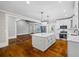 Spacious kitchen featuring stainless steel appliances, a central island, and white cabinets at 159 S Forest S Ave, Social Circle, GA 30025