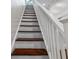 A staircase featuring wood stairs and white trim at 159 S Forest S Ave, Social Circle, GA 30025