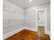 Spacious walk-in closet with wire shelving and hardwood floors connecting to a nearby room at 159 S Forest S Ave, Social Circle, GA 30025