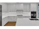 Bright kitchen with white cabinets, quartz countertops, stainless steel appliances, and hardwood floors at 2520 Peachtree Nw Rd # 403, Atlanta, GA 30305