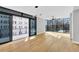 Spacious living room features hardwood flooring, ceiling fan, and large windows that provide natural light at 2520 Peachtree Nw Rd # 403, Atlanta, GA 30305