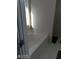 Bathtub with tile surround and a view of a window in a bright, naturally lit bathroom at 2918 Egret Ln, Austell, GA 30106