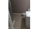 Bathroom featuring a toilet, vanity with sink, and a partial view of the shower stall at 2918 Egret Ln, Austell, GA 30106