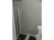 This bathroom features a walk-in shower with glass doors, neutral walls, and a brown rug at 2918 Egret Ln, Austell, GA 30106