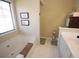 Bright bathroom featuring a soaking tub, white vanity, and neutral tile flooring at 2918 Egret Ln, Austell, GA 30106