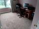 Bedroom currently set up as home office with desk, chairs, and computer at 2918 Egret Ln, Austell, GA 30106