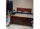 Spacious bedroom with a large wooden bed frame and closet in the background at 2918 Egret Ln, Austell, GA 30106