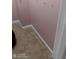 A bedroom with light pink walls and beige carpeting at 2918 Egret Ln, Austell, GA 30106