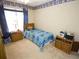 Welcoming bedroom with a cozy bed, a large window, and classic decor at 2918 Egret Ln, Austell, GA 30106