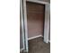 An open closet with an installed shelf and white folding doors at 2918 Egret Ln, Austell, GA 30106