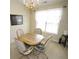 Traditional dining room with a chandelier and a bright window allowing natural light at 2918 Egret Ln, Austell, GA 30106