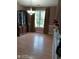 Dining room featuring natural light, wood floors, and wooden hutch at 2918 Egret Ln, Austell, GA 30106
