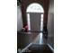 Welcoming entryway with decorative tile flooring, arched transom window above the front door, and stair access at 2918 Egret Ln, Austell, GA 30106