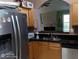 Spacious kitchen with stainless steel appliances and black countertops at 2918 Egret Ln, Austell, GA 30106