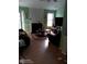 Inviting living room with fireplace, plenty of natural light, and wood-look flooring, perfect for gatherings at 2918 Egret Ln, Austell, GA 30106