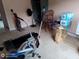 Living room area used as a fitness space with cardio equipment and weights at 2918 Egret Ln, Austell, GA 30106