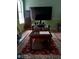 Cozy living room setup with wooden table, rug, and television at 2918 Egret Ln, Austell, GA 30106