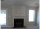 Living room featuring a modern fireplace and mantle, and large bright windows at 2918 Egret Ln, Austell, GA 30106
