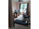 Home workout room equipped with exercise equipment, including a treadmill and elliptical machine at 2918 Egret Ln, Austell, GA 30106
