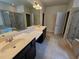 Bathroom featuring double sinks, a soaking tub, and a separate glass-enclosed shower at 2948 Goldfinch Cir, Marietta, GA 30066