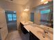 Bright bathroom with double vanity, tile flooring, large mirror and lots of natural light at 2948 Goldfinch Cir, Marietta, GA 30066