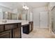 Bathroom with double vanity, dark wood cabinets, and large mirror at 2948 Goldfinch Cir, Marietta, GA 30066