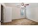 Well-lit bedroom featuring plush carpeting, a ceiling fan, and ample natural light at 2948 Goldfinch Cir, Marietta, GA 30066