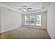 Spacious bedroom featuring wall-to-wall carpeting, a ceiling fan, and triple window with natural light at 2948 Goldfinch Cir, Marietta, GA 30066