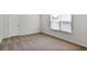 Well-lit bedroom features plush carpeting and large window for natural light at 2948 Goldfinch Cir, Marietta, GA 30066