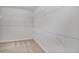 Spacious walk-in closet with carpet and wire shelving for maximum storage at 2948 Goldfinch Cir, Marietta, GA 30066
