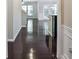 Inviting hallway with gleaming hardwood floors leading to a bright and open living area at 2948 Goldfinch Cir, Marietta, GA 30066