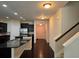 Open layout with kitchen island, black granite countertops and stainless steel appliances at 2948 Goldfinch Cir, Marietta, GA 30066
