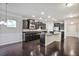Open kitchen with dark cabinetry, stainless steel appliances, island, and seamless integration to living area at 2948 Goldfinch Cir, Marietta, GA 30066