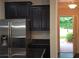 Kitchen features modern stainless steel appliances, granite countertops, and dark cabinets at 2948 Goldfinch Cir, Marietta, GA 30066