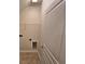 A well-lit laundry room with white walls, tiled floors, and convenient shelving and utility hookups at 2948 Goldfinch Cir, Marietta, GA 30066