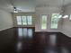 Spacious living room featuring hardwood floors, large windows, and a modern ceiling fan at 2948 Goldfinch Cir, Marietta, GA 30066